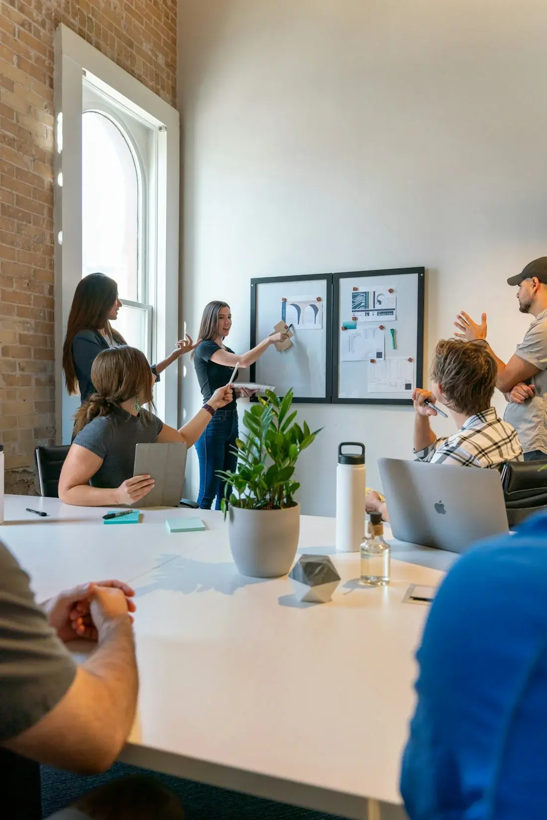 Colleagues in a meeting at a white table
